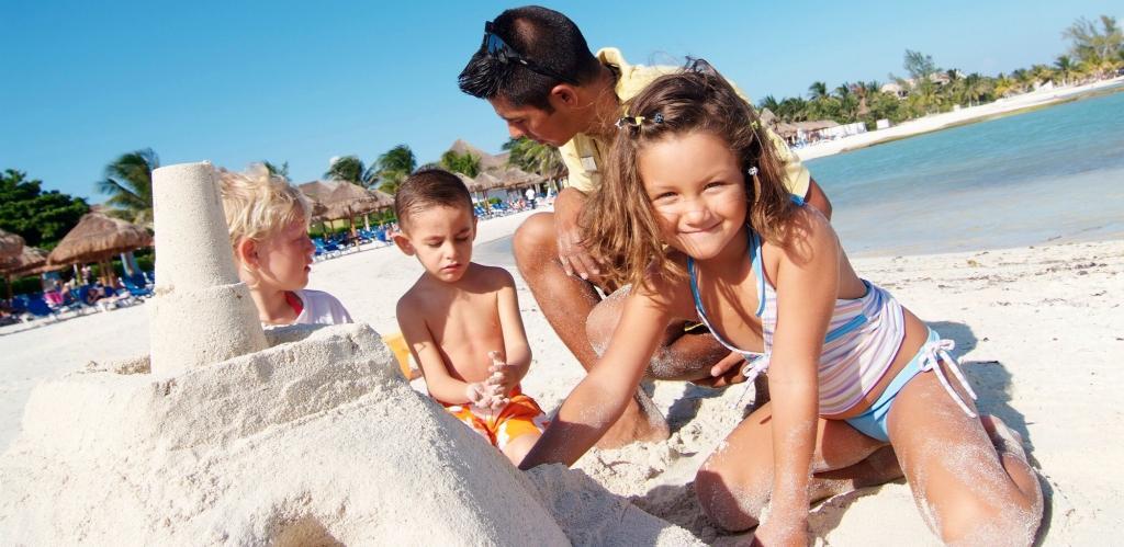 Family building sand castle