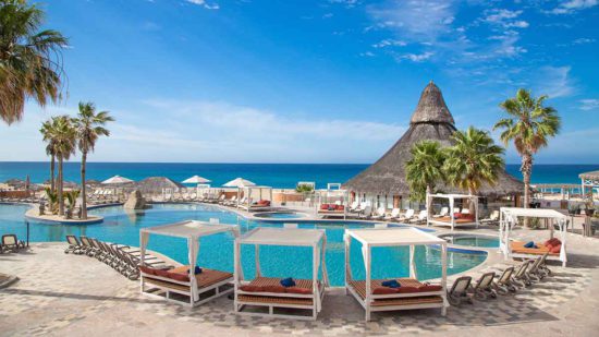 Black Friday All Inclusive Vacation Deals 2023 at beautiful pool with a palapa